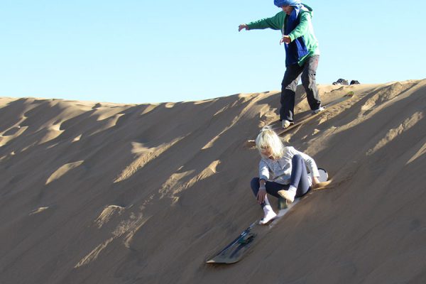 Sandboarding in the dunes