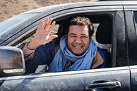 Ali Laghfiri, sitting in the SUV